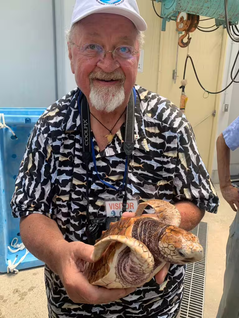 Co-author Larry Crowder poses with a loggerhead sea turtle. (Image credit: Dana Briscoe)