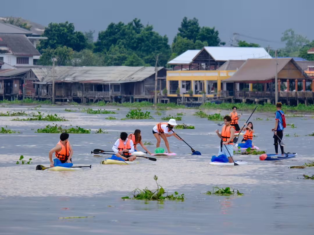 The organization’s annual “paddle for debris” event invites young volunteers to clean up the Chao Phraya River. Over three years, participants have collected over 2,200 pounds of trash. (Image credit: Khun Apiphawadee Snidvongs)